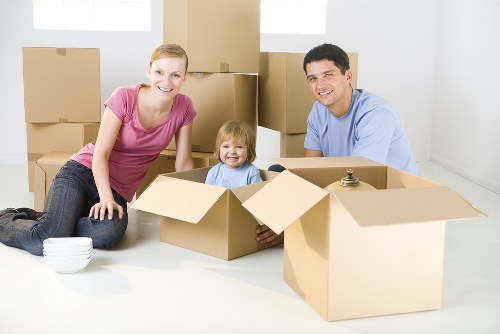 Commercial moving team preparing office furniture for relocation in Barnes