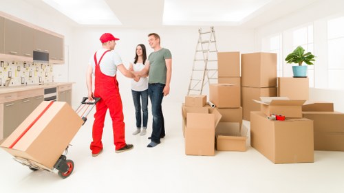 Mover in PPE protecting furniture and property during relocation
