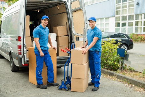 Furniture and workstations loaded carefully for a business move in Barnes