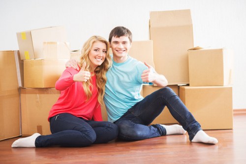 Local Barnes movers organizing packed boxes and furniture for transport