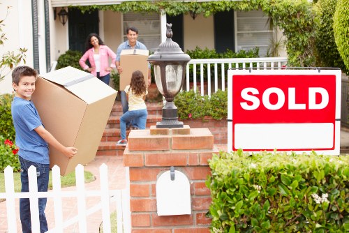 Local movers managing a Barnes apartment move in a modern residential block